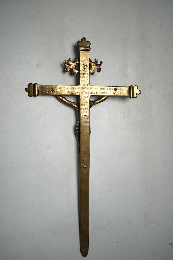 An 18th century Spanish bronze crucifix commemorating the papal visit of Pope Clementine XIII in 1762, 33.5cm long. Condition - fair